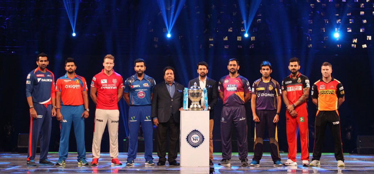 Captains of the IPL franchises pose with the trophy during the opening ceremony, Mumbai, April 8, 2016