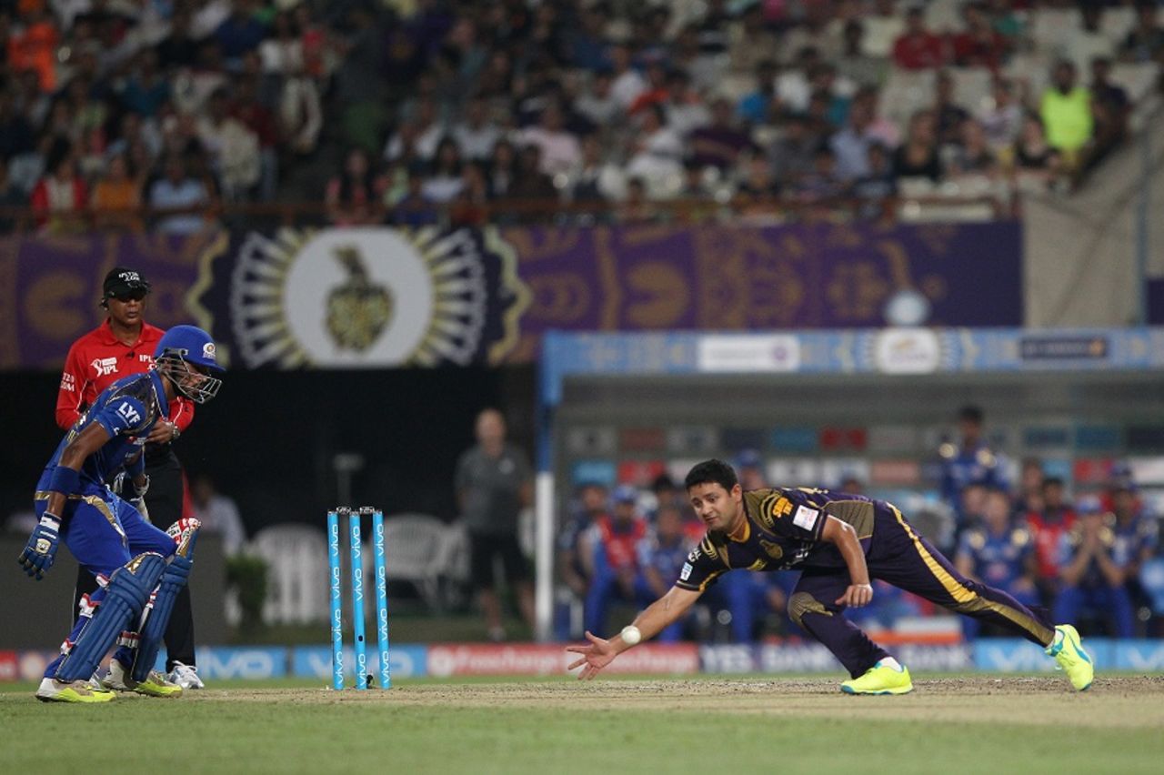 Piyush Chawla tries to field the ball off his own bowling, Kolkata Knight Riders v Mumbai Indians, IPL 2016, Kolkata, April 13, 2016