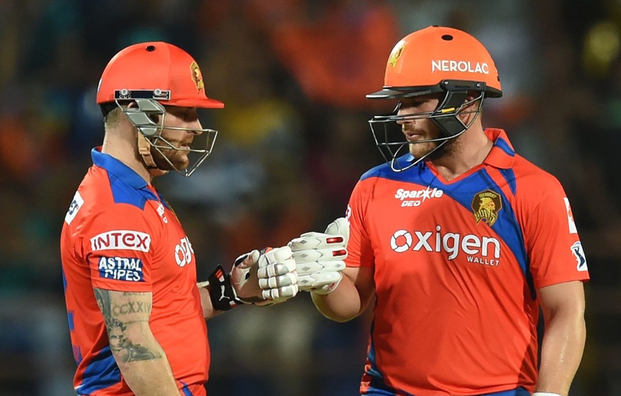 Brendon McCullum and Aaron Finch punch gloves during their 85-run opening stand, Gujarat Lions v Rising Pune Supergiants, IPL 2016, Rajkot, April 14, 2016