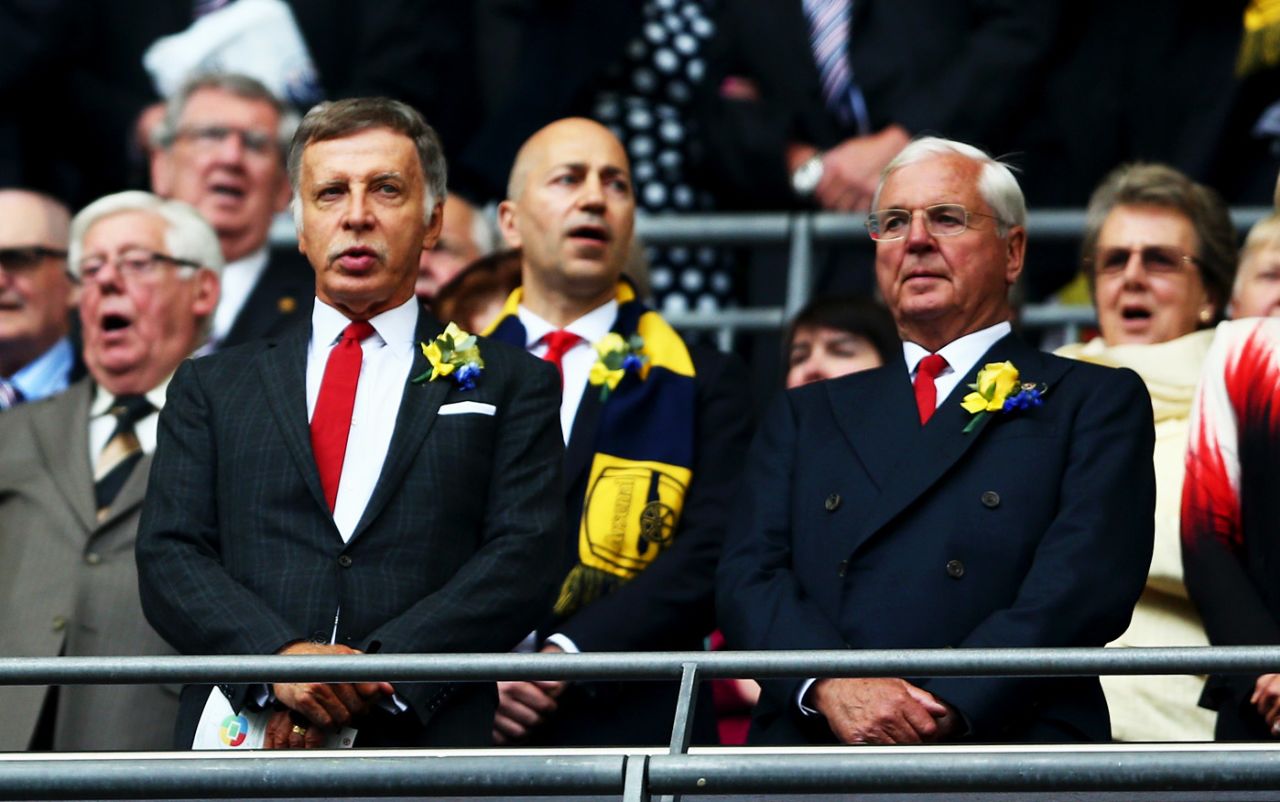 Arsenal director Stan Kroenke and chairman Sir Chips Keswick look on prior to the FA Cup final between Aston Villa and Arsenal at Wembley Stadium, May 30, 2015 