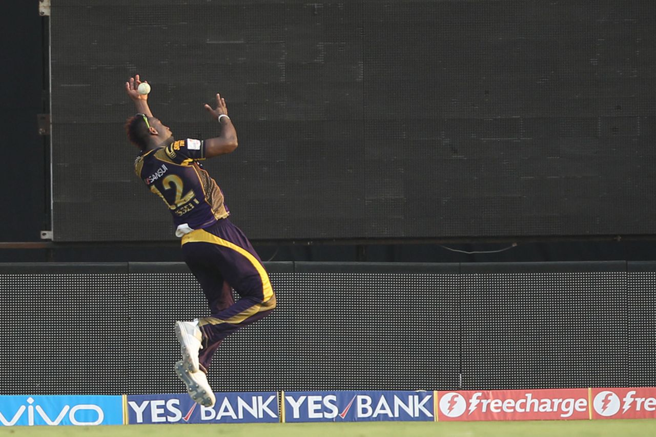 Andre Russell athletically lobs the ball in play before Piyush Chawla completes the catch, Sunrisers Hyderabad v Kolkata Knight Riders, IPL 2016, Hyderabad, April 16, 2016