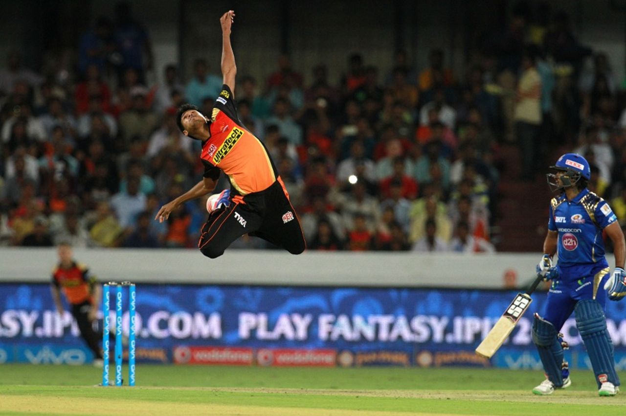 An acrobatic Mustafizur Rahman tries to stop the ball off his bowling, Sunrisers Hyderabad v Mumbai Indians, IPL 2016, Hyderabad, April 18, 2016