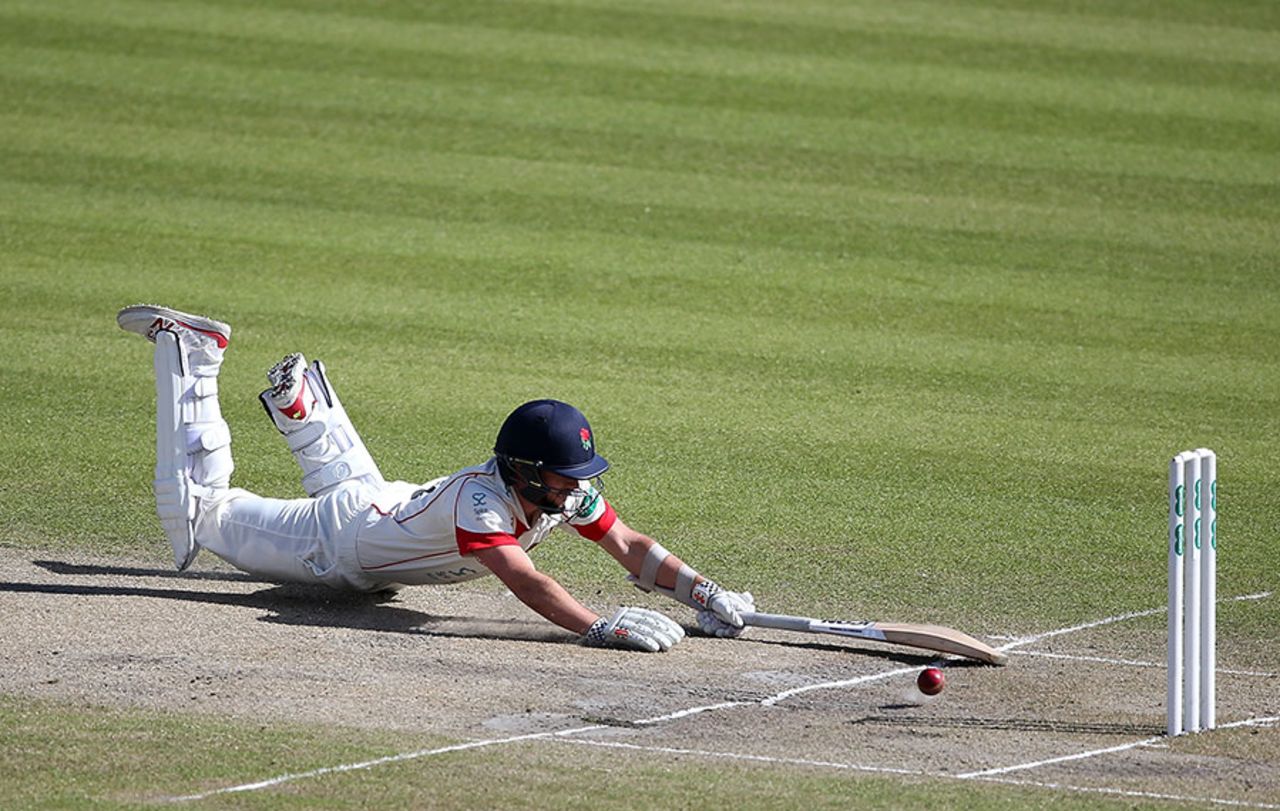 Simon Kerrigan dives to make his ground, Lancashire v Nottinghamshire, Specsavers County Championship, Division One, Old Trafford, 3rd day, April 19, 2016