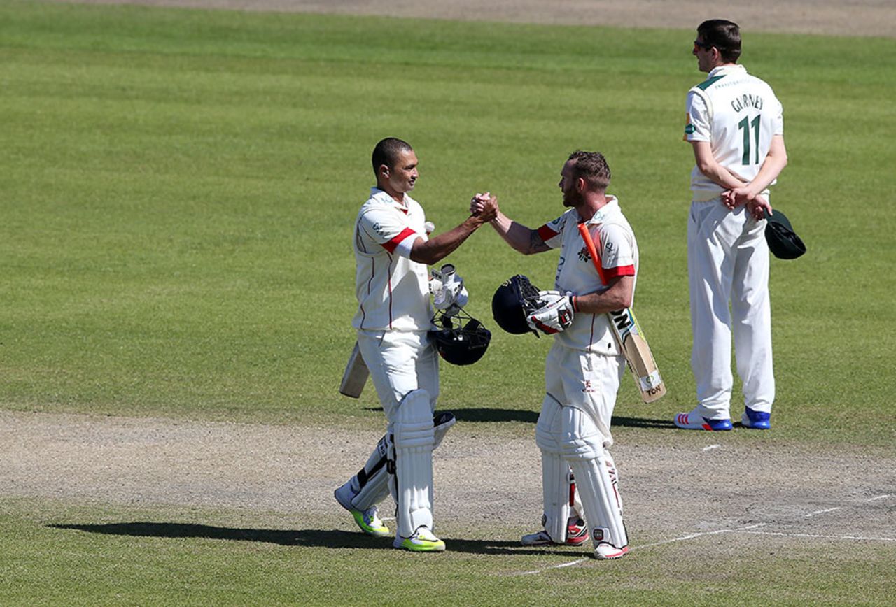 Luke Procter and Alviro Petersen celebrate Lancashire's victory, Lancashire v Nottinghamshire, Specsavers County Championship, Division One, Old Trafford, 4th day, April 20, 2016