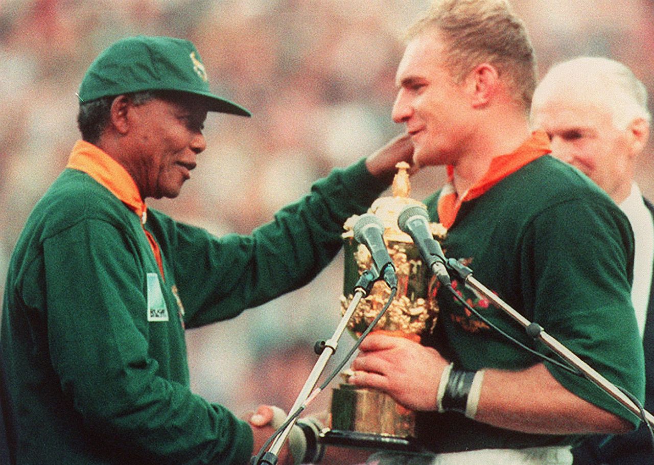 South Africa captain Francois Pienaar receives the rugby World Cup from President Nelson Mandela, Ellis Park, Johannesburg, 24 June 1995