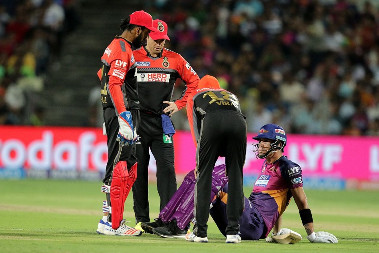 Royal Challengers Bangalore players check on Kevin Pietersen after he picks up an injury, Rising Pune Supergiants v Royal Challengers Bangalore, IPL 2016, Pune, April 22, 2016