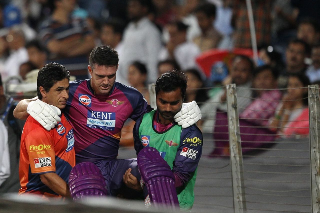 Kevin Pietersen is helped off the field after retiring hurt due to injury, Rising Pune Supergiants v Royal Challengers Bangalore, IPL 2016, Pune, April 22, 2016