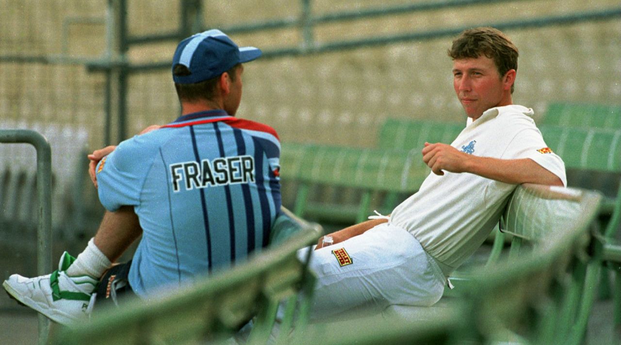Mike Atherton talks to Angus Fraser during a net session in Melbourne, December 12, 1994