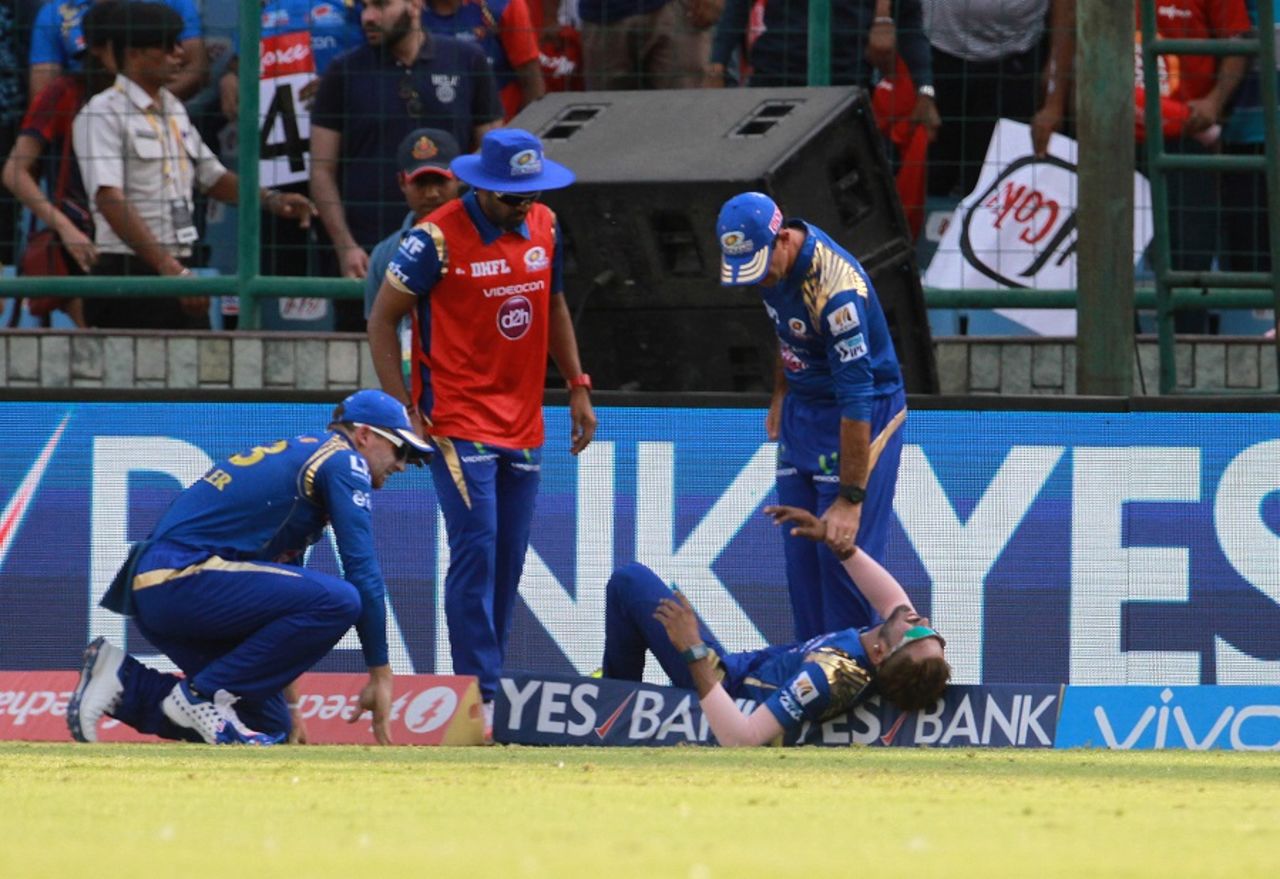 Hardik Pandya is attended to after a collision with Jos Buttler, Delhi Daredevils v Mumbai Indians, IPL 2016, Delhi, April 23, 2016