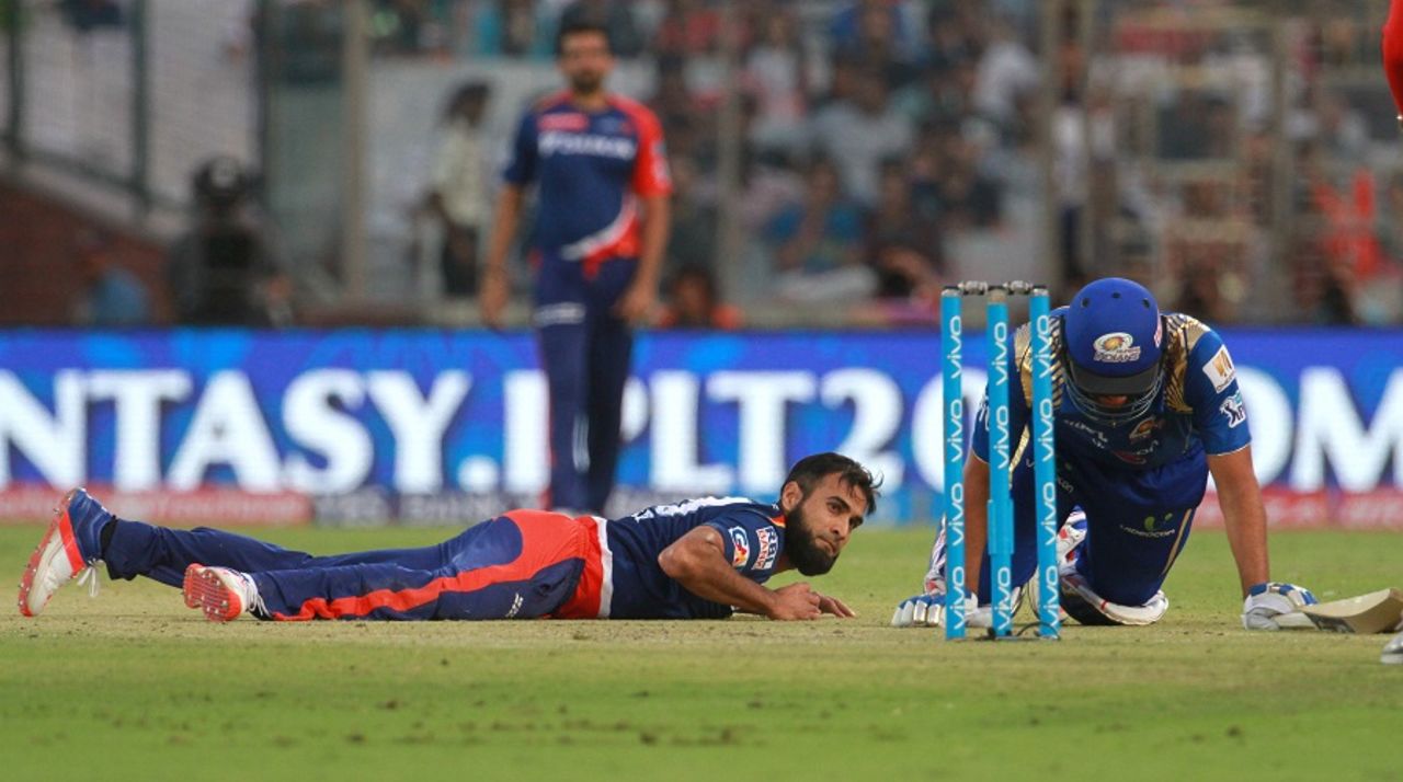 Imran Tahir fields the ball even as Rohit Sharma makes his way back to the crease, Delhi Daredevils v Mumbai Indians, IPL 2016, Delhi, April 23, 2016