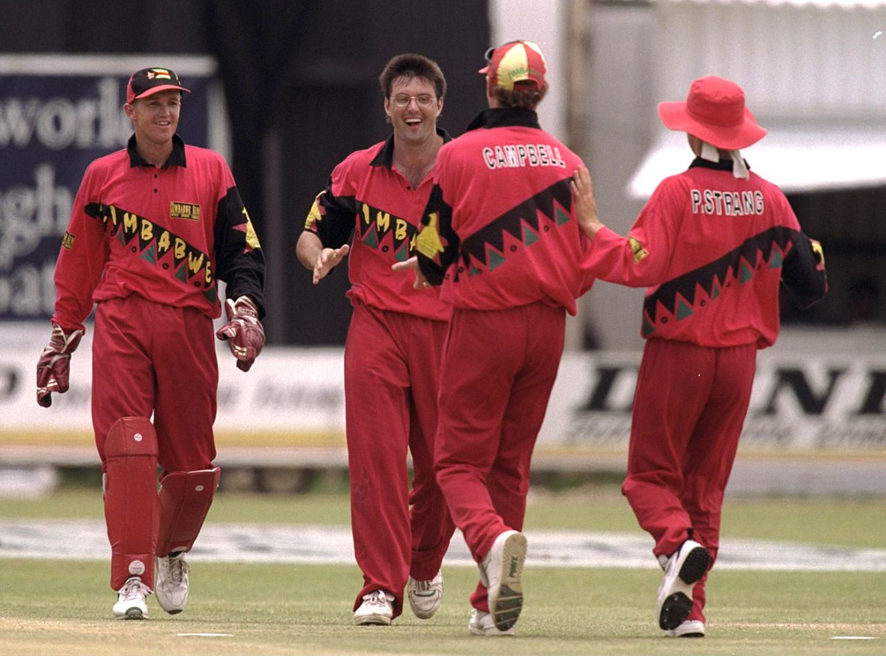 Andy Flower, John Rennie, Alistair Campbell and Paul Strang celebrate, Zimbabwe v England, 1st ODI, Bulawayo, December 15, 1996