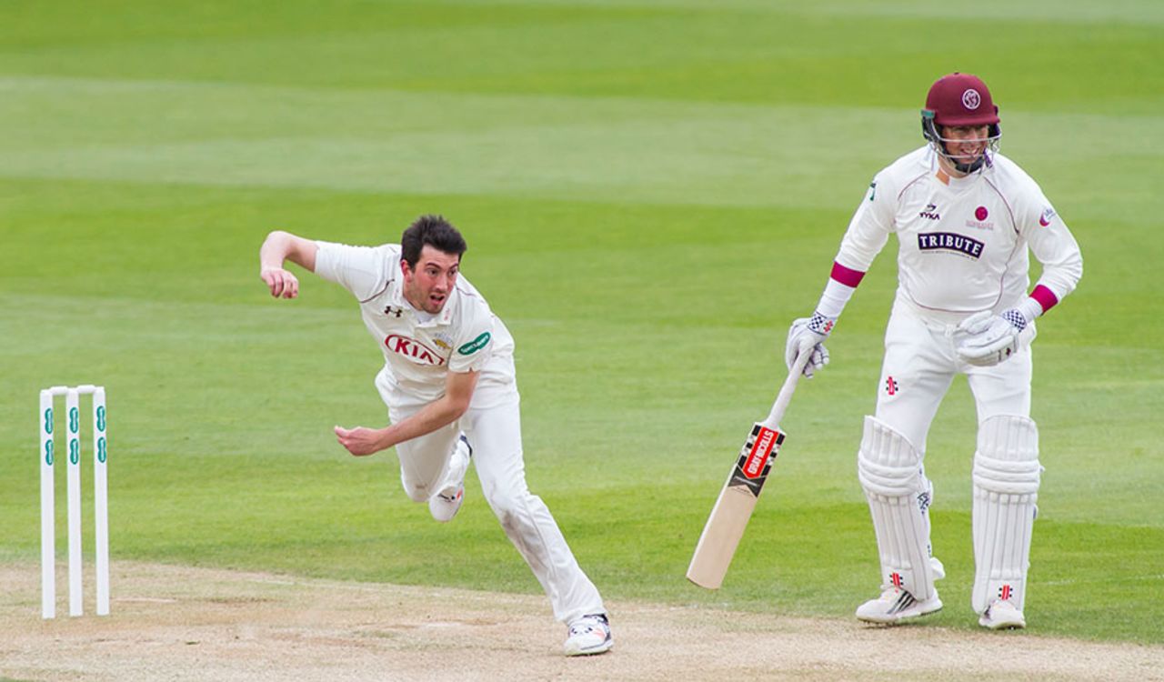 Mark Footitt bowls for Surrey as Marcus Trescothick looks on, Surrey v Somerset, Specsavers County Championship, Division One, The Oval, 2nd day, April 25, 2016
