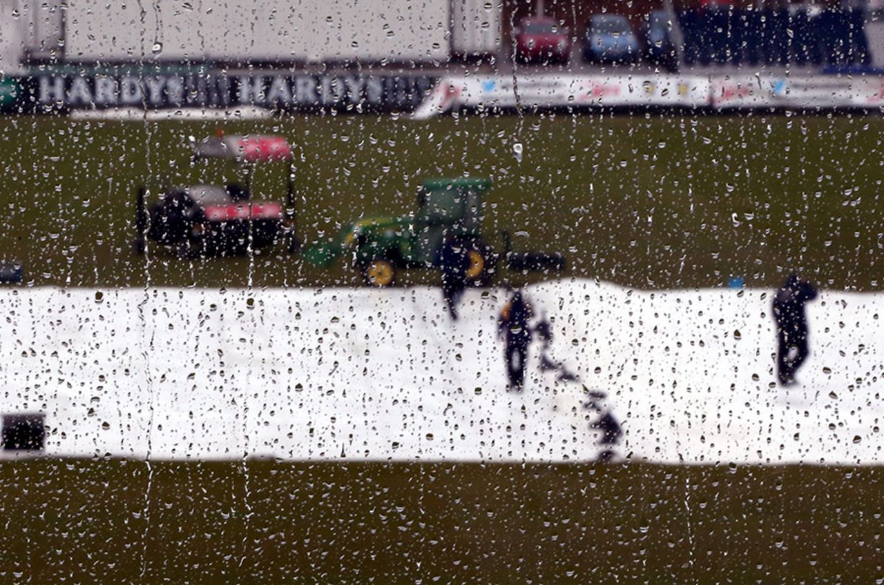 The groundstaff deal with another shower at Chester-le-Street, Durham v Middlesex, County Championship, Division One, Chester-le-Street, 3rd day, April 26, 2015