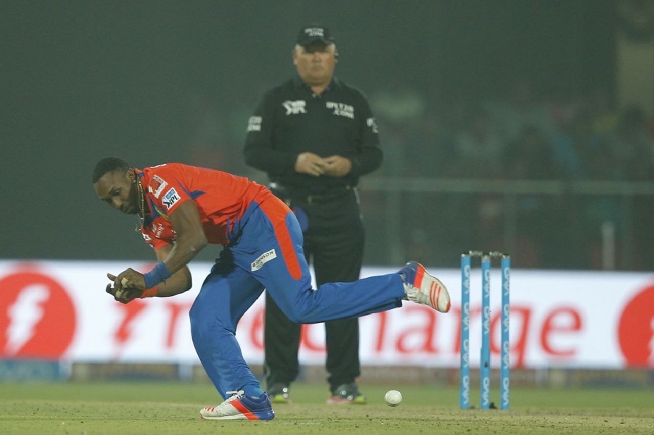 Dwayne Bravo tries to field the ball off his own bowling, Delhi Daredevils v Gujarat Lions, IPL 2016, Delhi, April 27, 2016