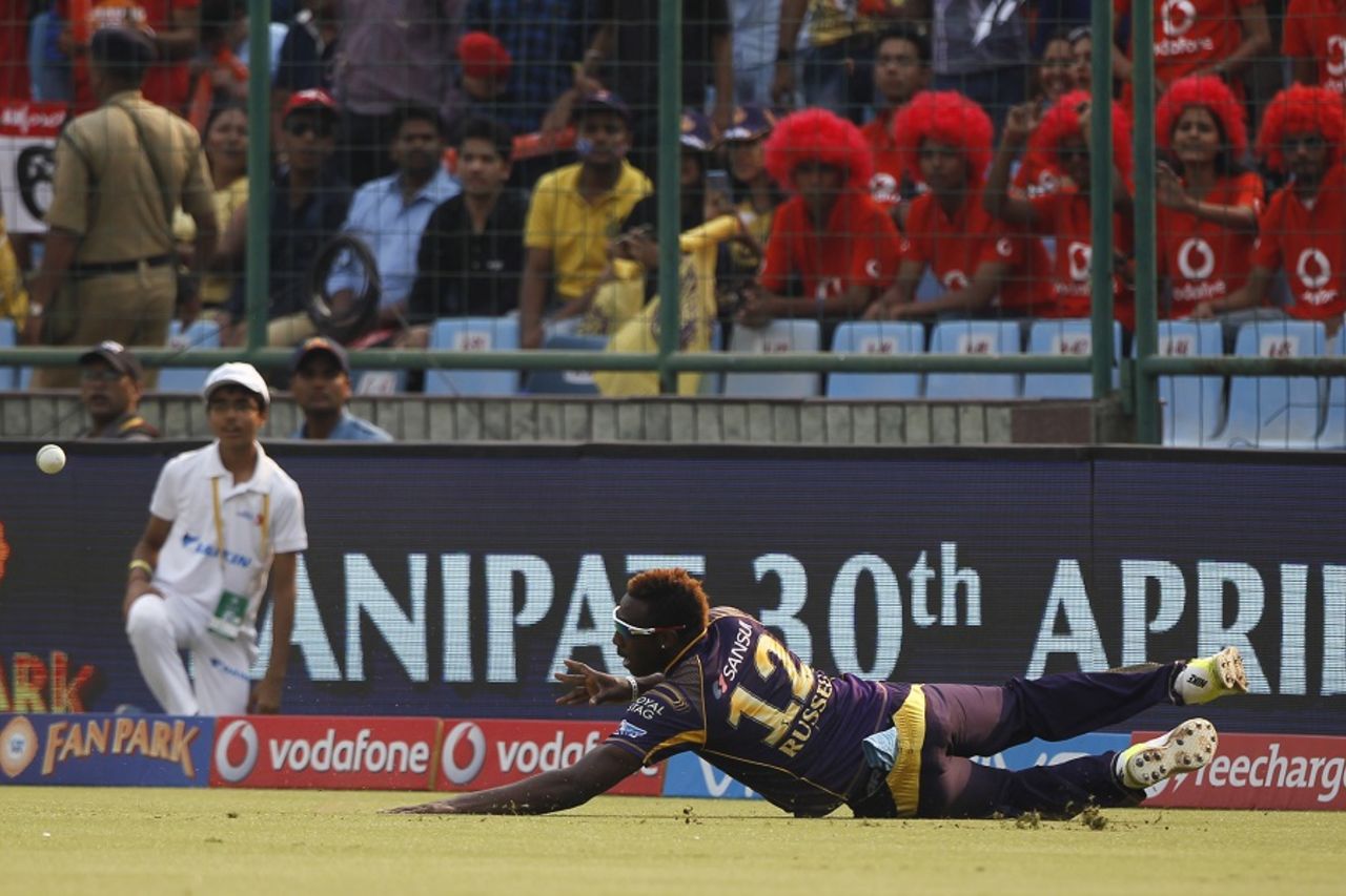 Andre Russell dives as he tries to stop the ball, Delhi Daredevils v Kolkata Knight Riders, IPL 2016, Delhi, April 30, 2016