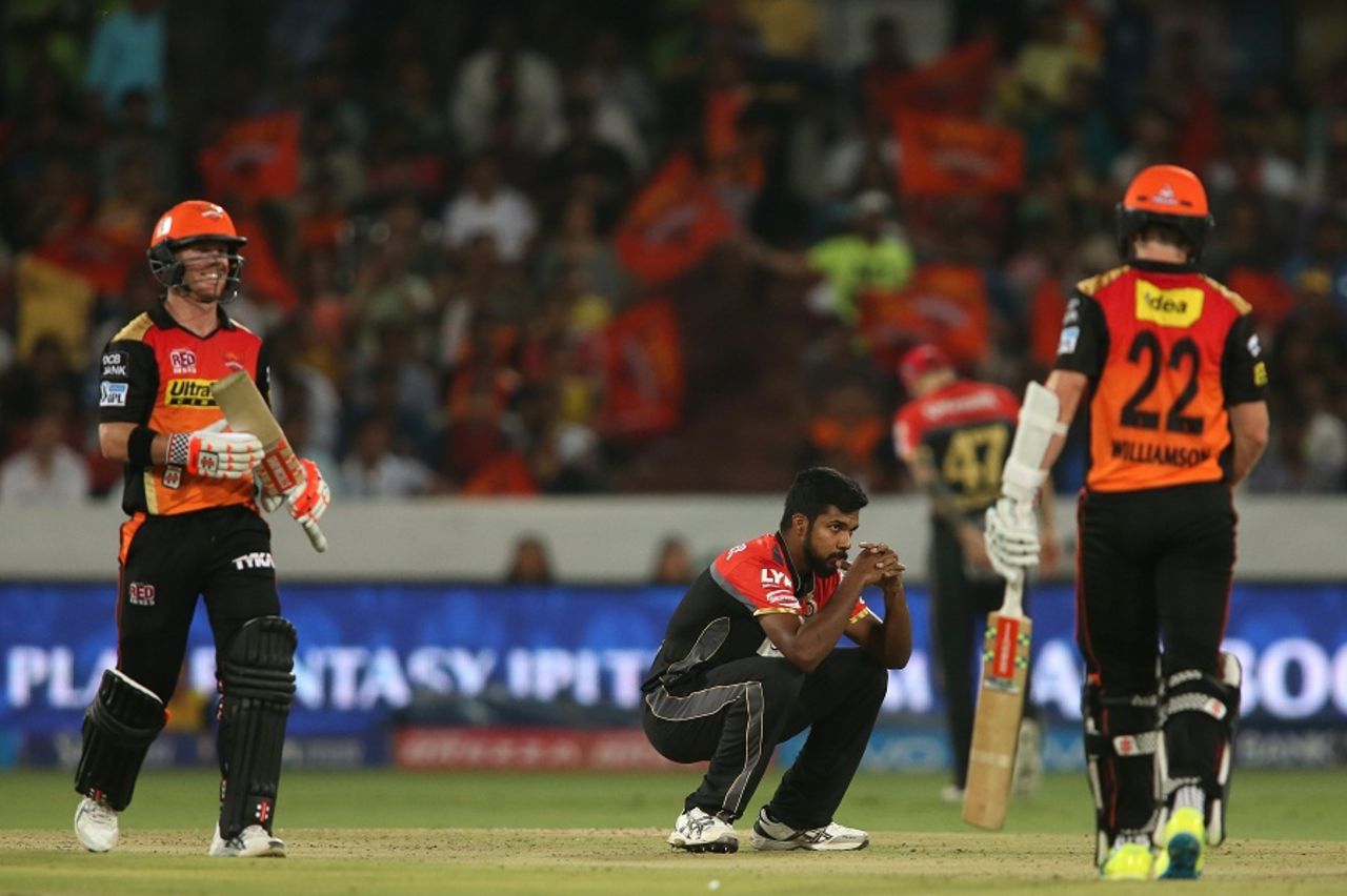 A frustrated Varun Aaron gets down on his haunches during David Warner and Kane Williamson's strong stand, Sunrisers Hyderabad v Royal Challengers Bangalore, IPL 2016, Hyderabad, April 30, 2016