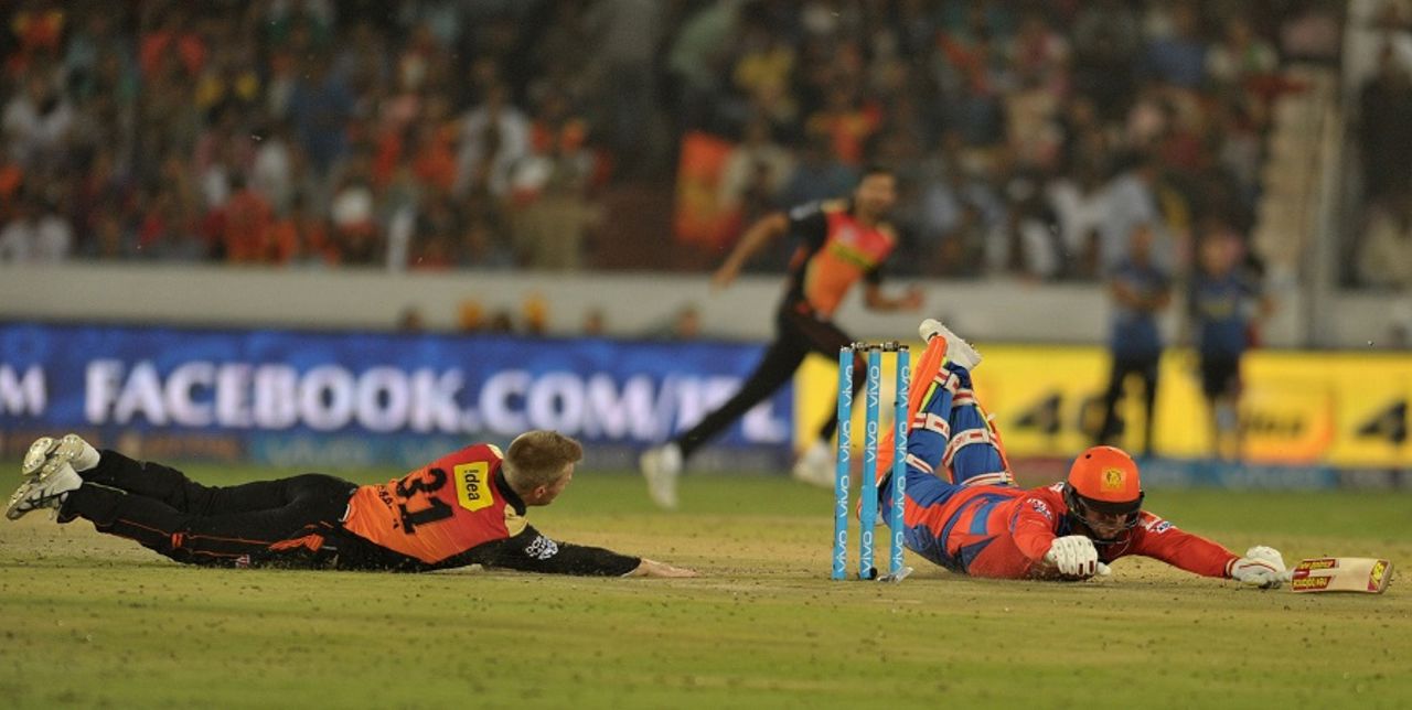 David Warner attempts a run out of Aaron Finch, Sunrisers Hyderabad v Gujarat Lions, IPL 2016, Hyderabad, May 6, 2016