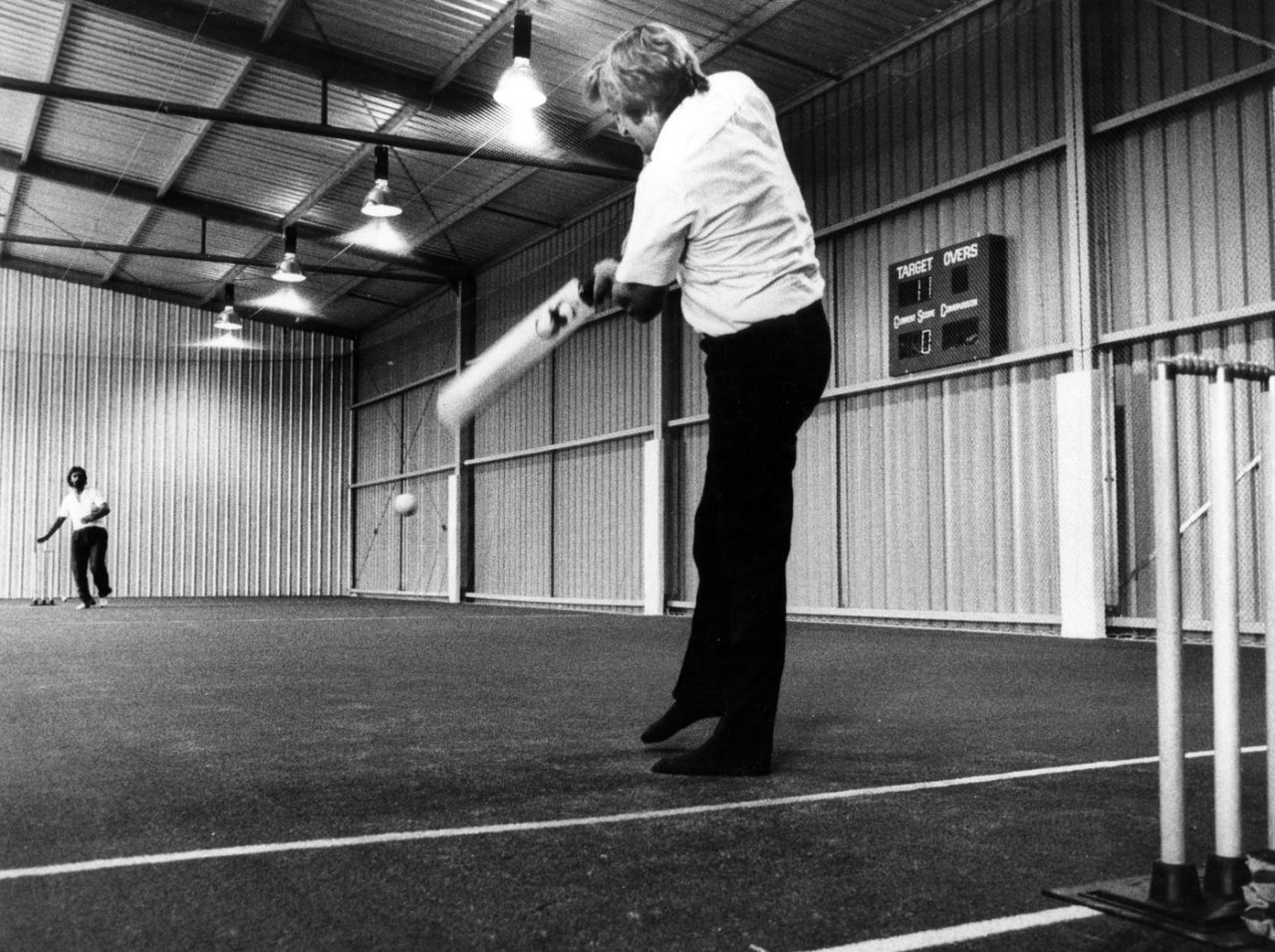 Gary Gilmour tries out the wicket at the new Cardiff Indoor Cricket centre, February 7, 1983
