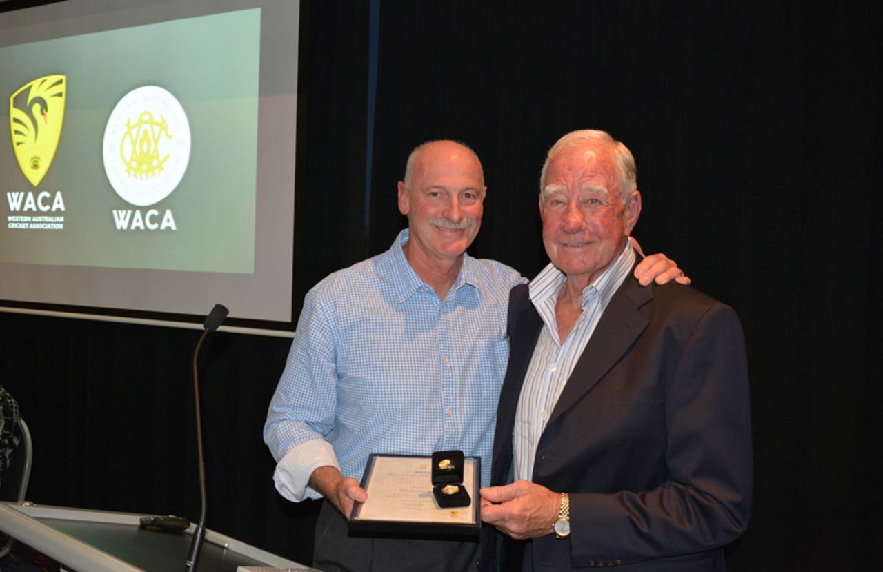 Keith Slater, a former Western Australia allrounder and Test player, receives an honorary life membership of the WACA from Dennis Lillee, 2013