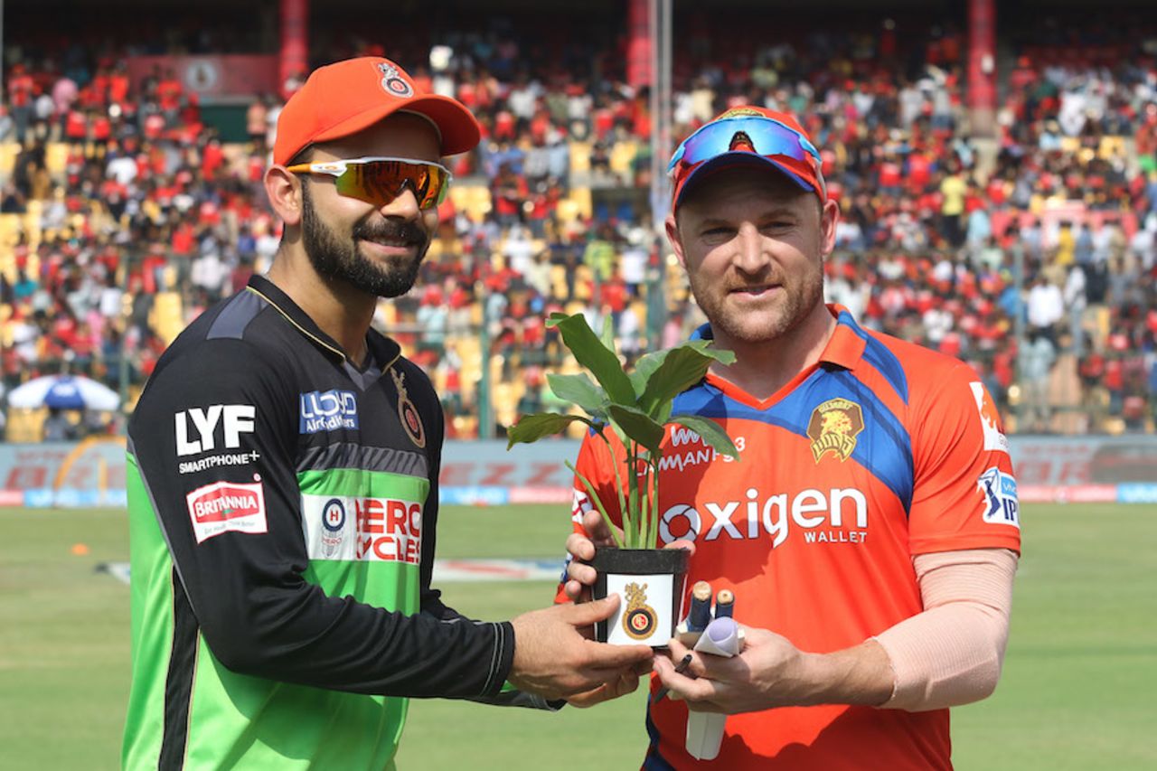 Virat Kohli wears a green kit and Brendon McCullum carries a plant as part of Royal Challengers Bangalore's green initiative, Royal Challengers Bangalore v Gujarat Lions, IPL 2016, Bangalore, May 14, 2016