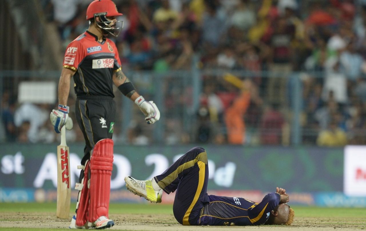 Andre Russell is on the floor after slipping on the followthrough, Kolkata Knight Riders v Royal Challengers Bangalore, IPL 2016, Kolkata, May 16, 2016