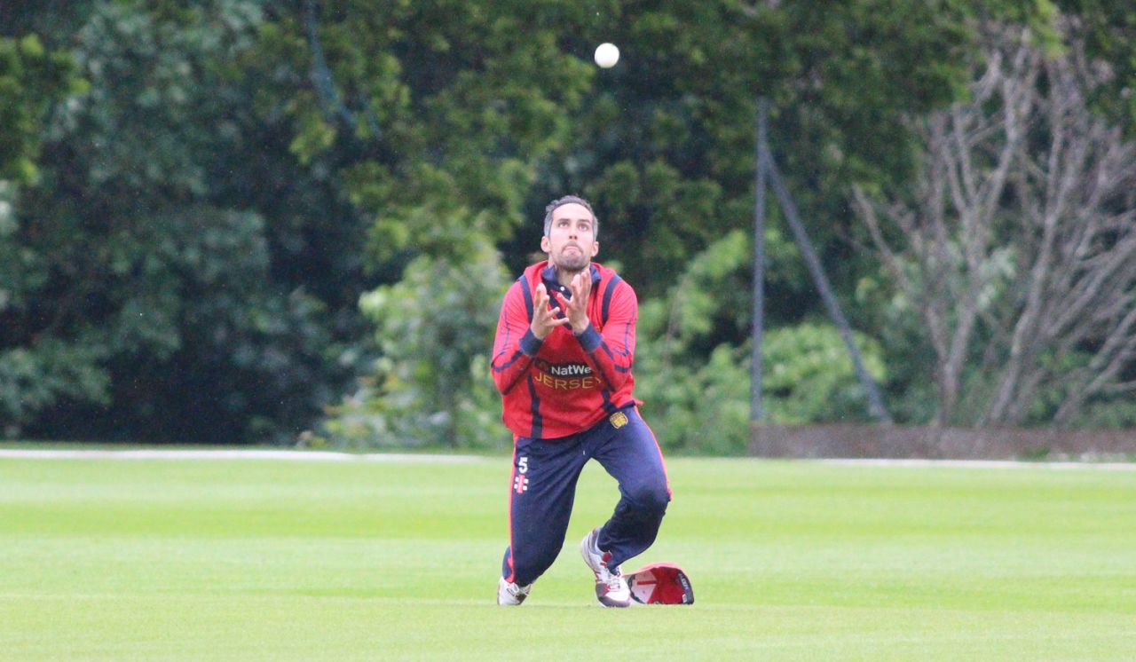 Peter Gough dives forward at midwicket to take a catch dismissing Rajeshkumar Ranpura, Jersey v Oman, ICC World Cricket League Division Five, St Saviour, May 21, 2016