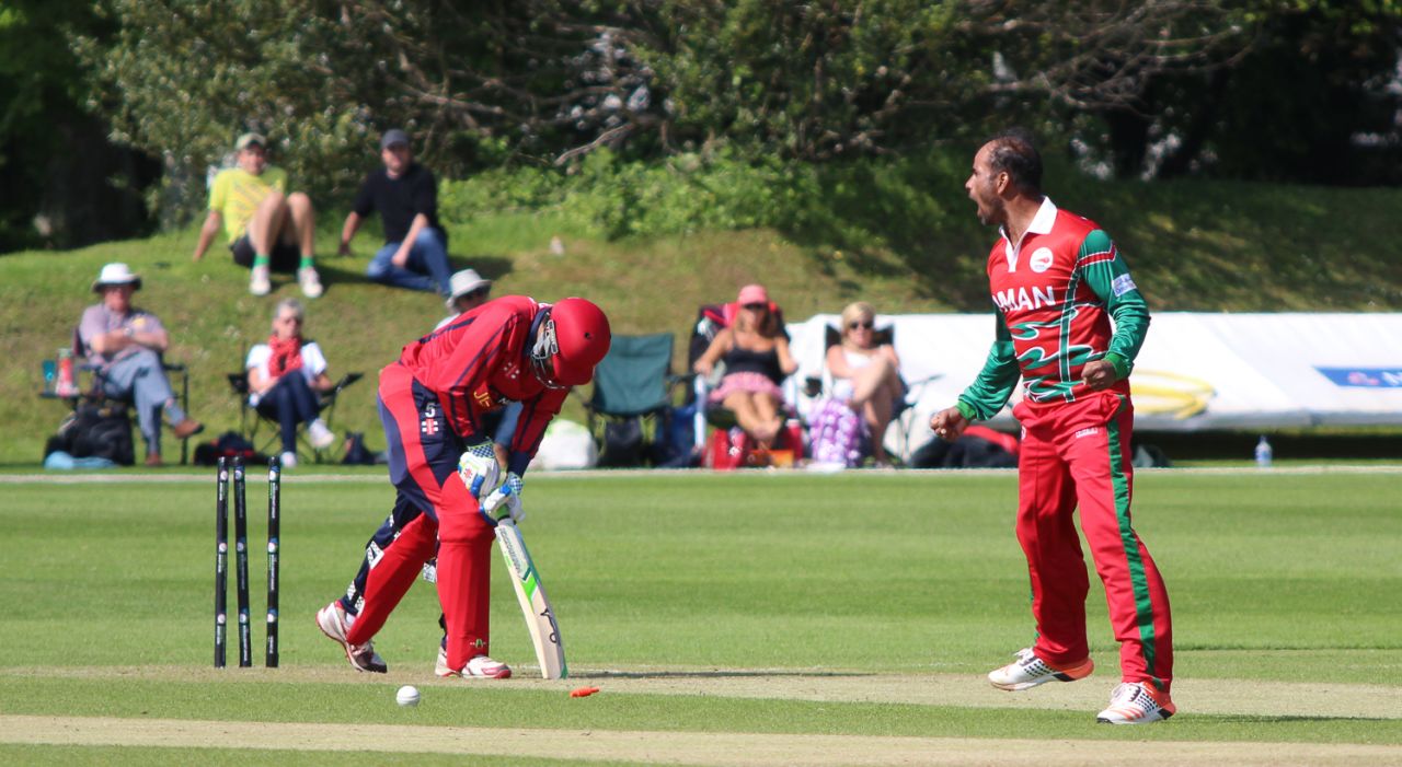 Munis Ansari yorks Peter Gough for the first of his five wickets, Jersey v Oman, ICC World Cricket League Division Five, St Saviour, May 23, 2016 