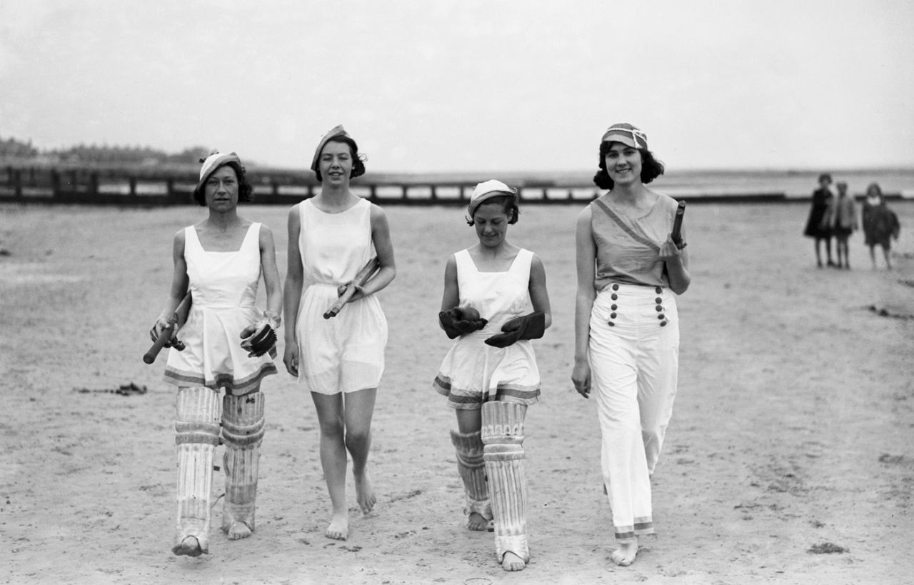 A group of women dressed for a game of cricket on the beach, May 12, 1934