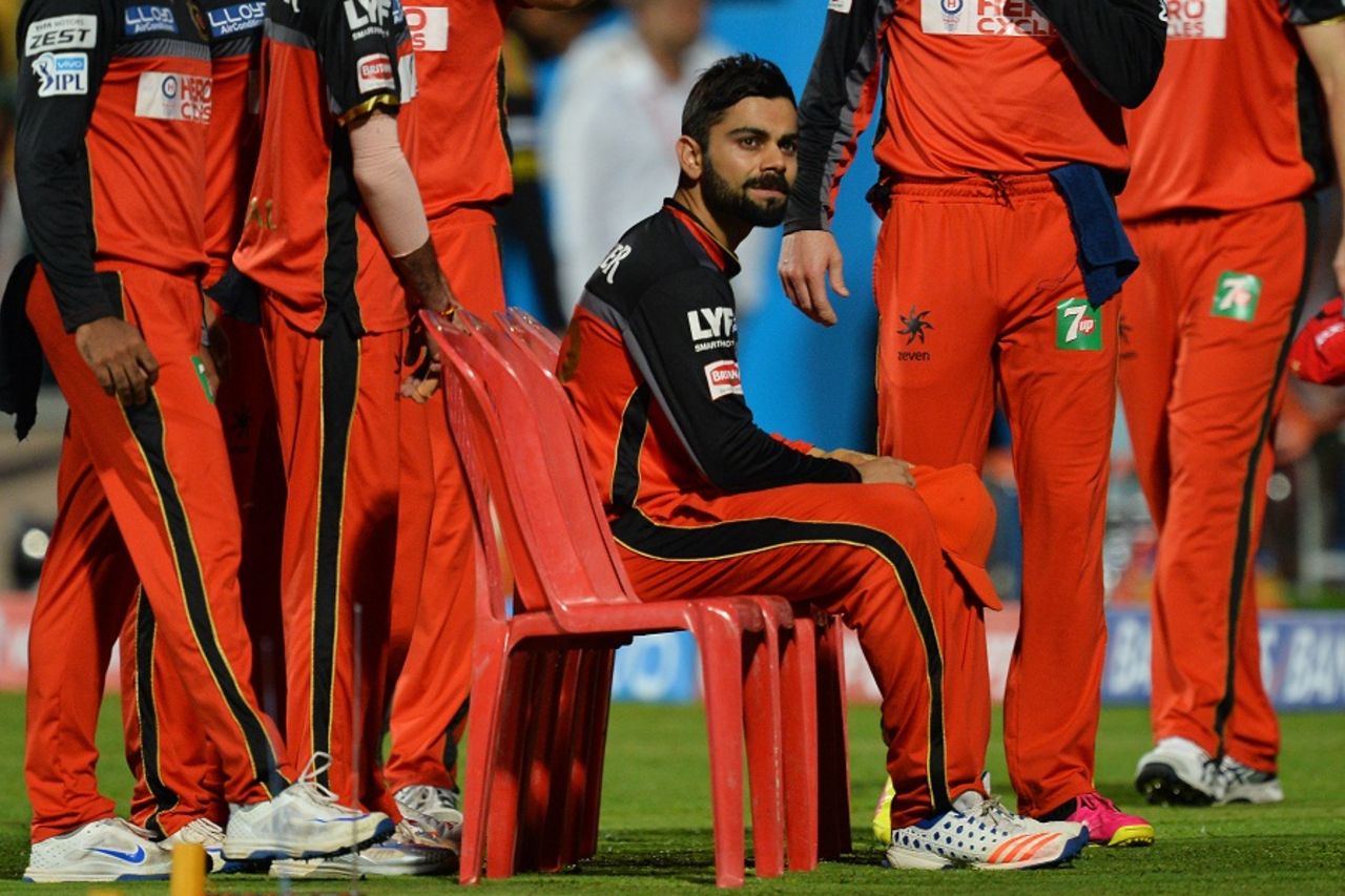 A pensive Virat Kohli waits for his team to gather around for a team photo ahead of the game, Royal Challengers Bangalore v Sunrisers Hyderabad, IPL 2016, final, Bangalore, May 29, 2016