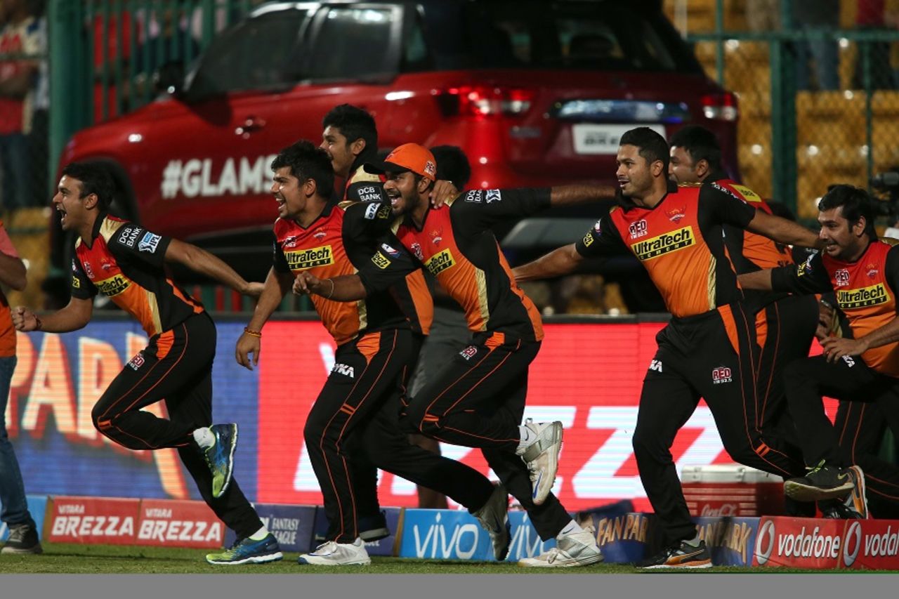 Sunrisers Hyderabad players rush on to the field to celebrate their maiden IPL title win, Royal Challengers Bangalore v Sunrisers Hyderabad, IPL 2016, final, Bangalore, May 29, 2016