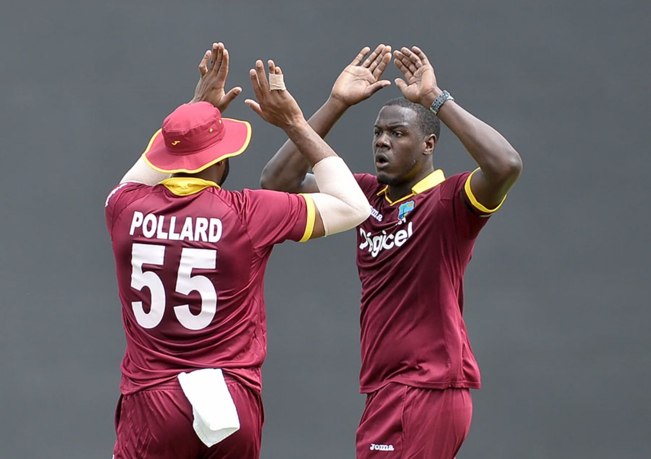 Carlos Brathwaite and Kieron Pollard get together after a wicket, West Indies v South Africa, ODI tri-series, 1st match, Providence, June 3, 2016
