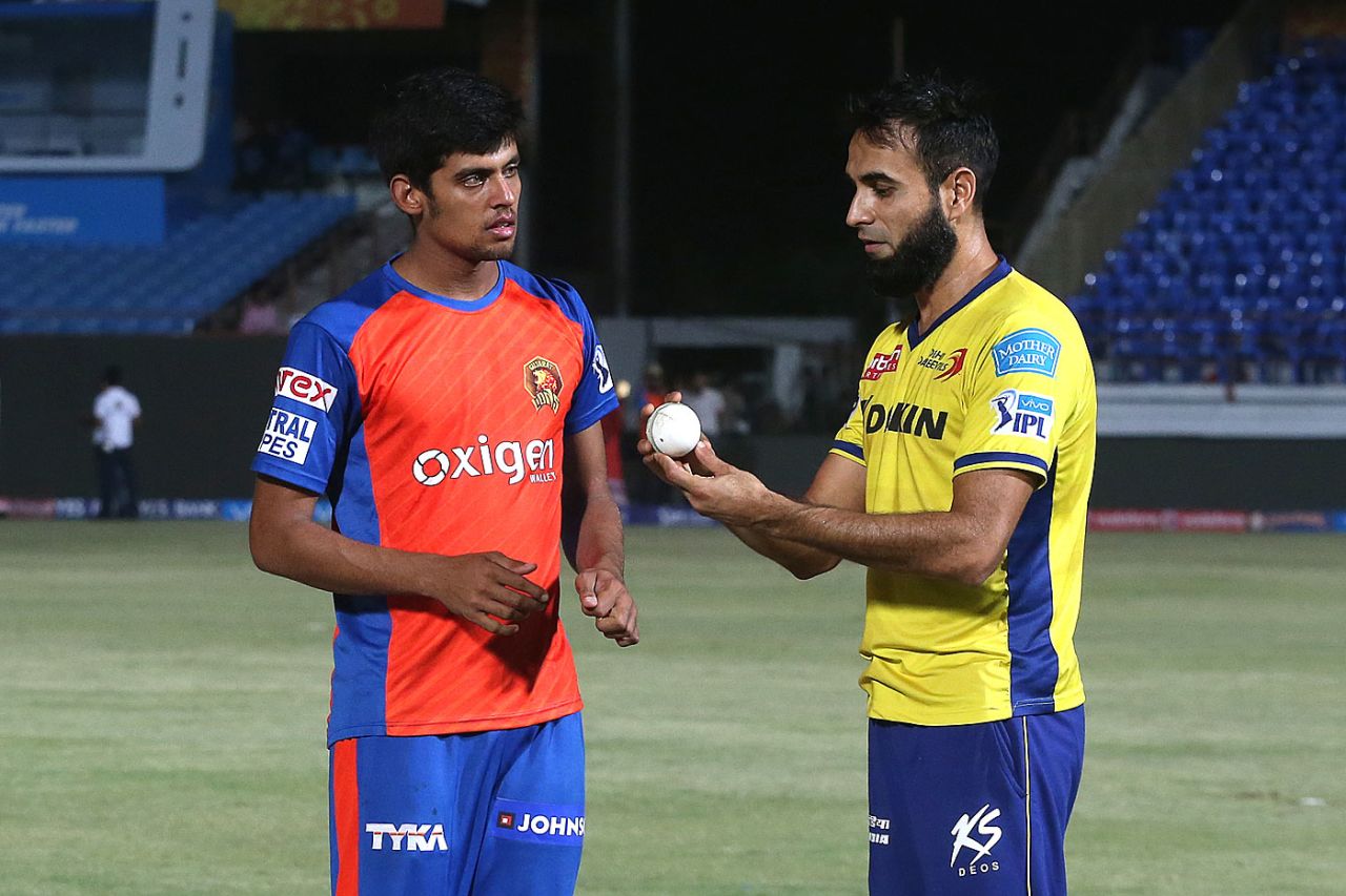 Imran Tahir shows Shivil Kaushik how to grip the ball, Rajkot, May 3, 2016