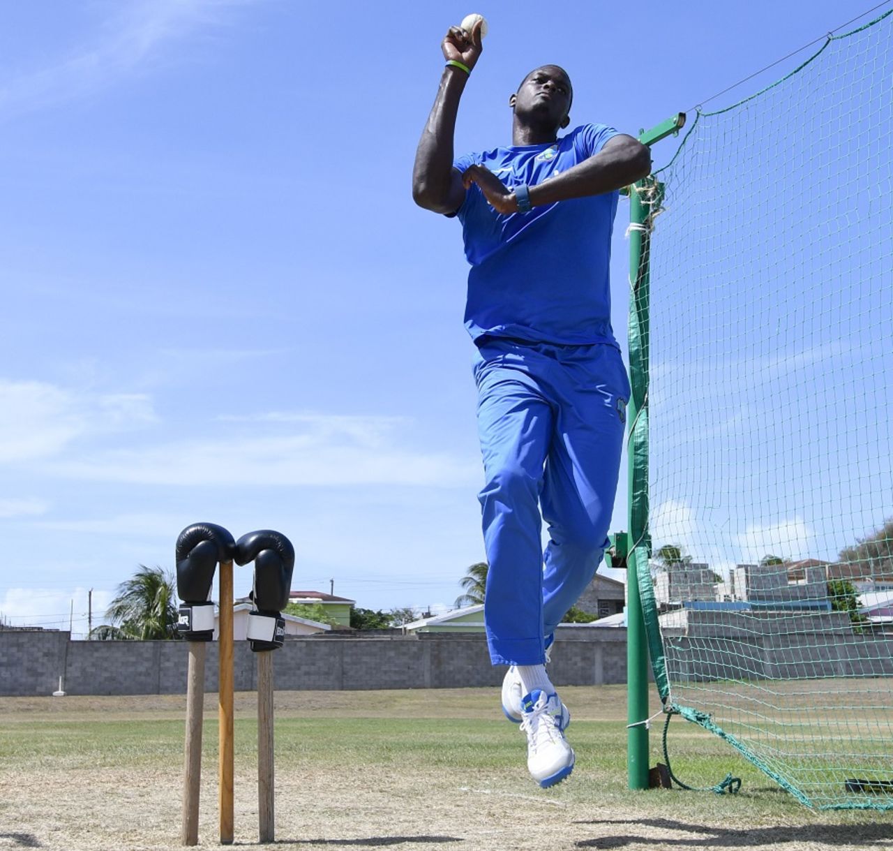 Tribute to Muhammad Ali: Jason Holder bowls in the nets with boxing gloves on the stumps, St Kitts, June 11, 2016
