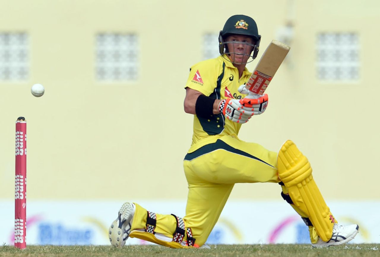 David Warner gets low to sweep, Australia v South Africa, 4th match, ODI tri-series, St Kitts, June 11, 2016