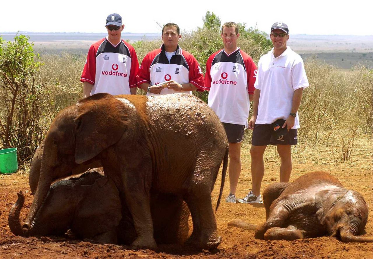 Matthew Hoggard, Darren Gough, Marcus Trescothick and Alec Stewart of England pose for a picture with the elephants at the Nairobi Game reserve, October 5, 2000