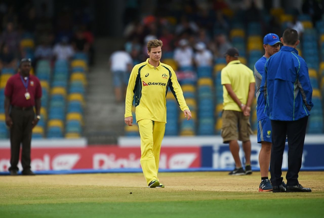 Steven Smith inspects the damp pitch, Australia v South Africa, 7th match, ODI tri-series, Barbados