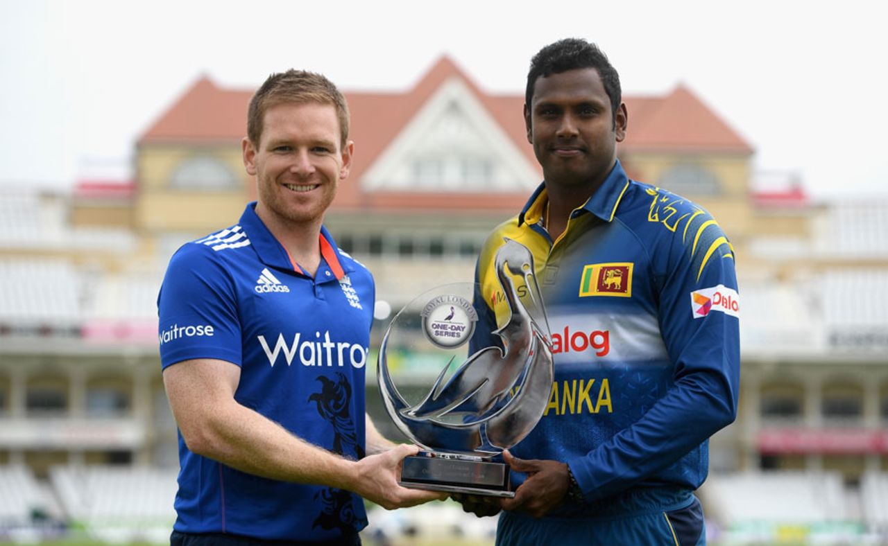 Eoin Morgan and Angelo Mathews pose with the series trophy, Trent Bridge, June 20, 2016