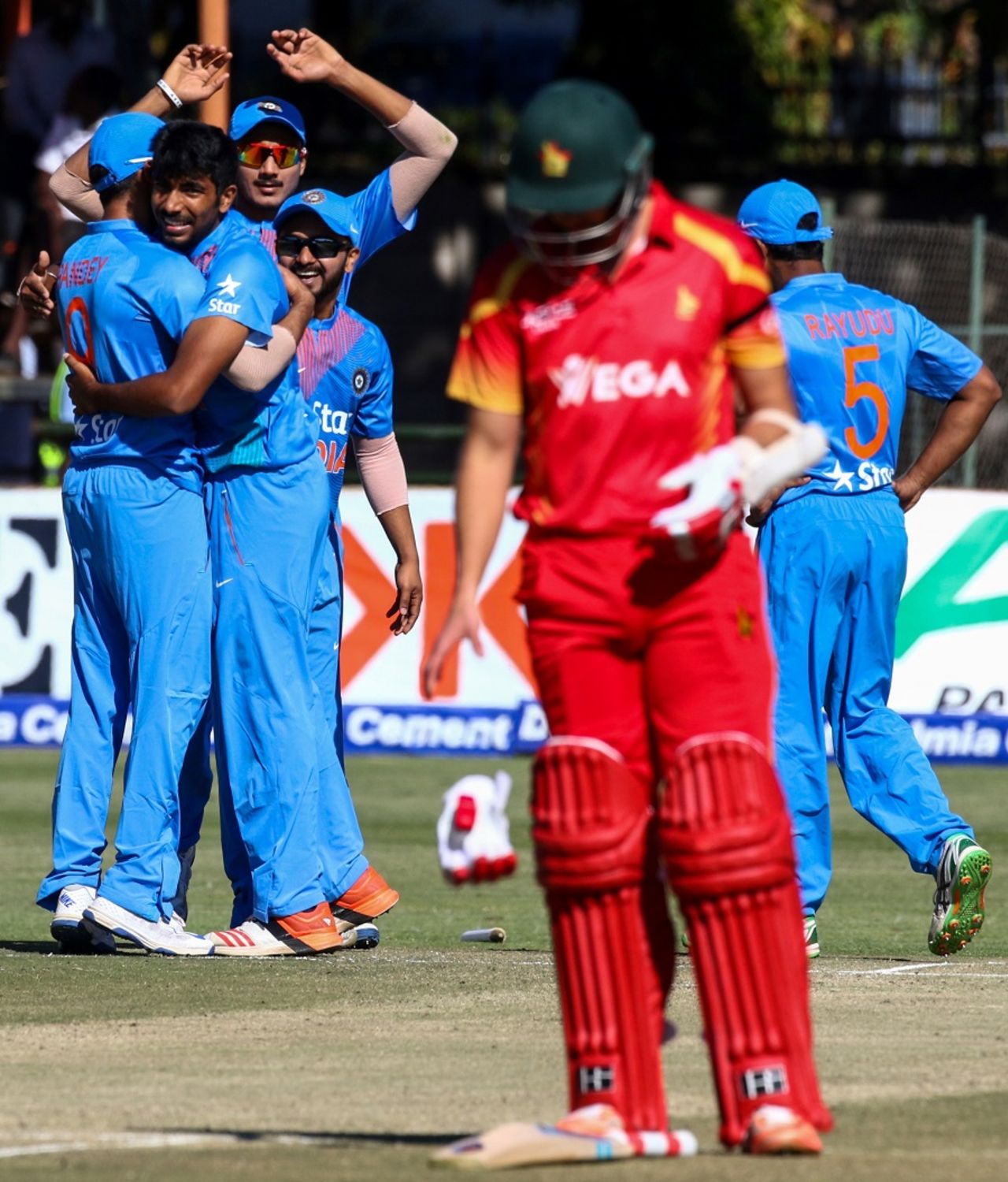 Jasprit Bumrah celebrates with team-mates after picking up a wicket, Zimbabwe v India, 2nd T20I, Harare, June 20, 2016