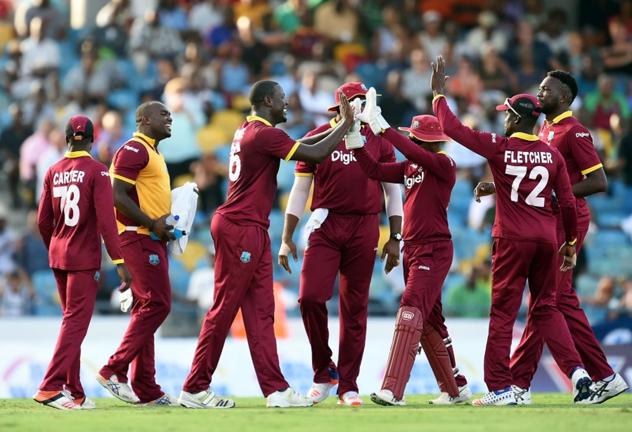 Carlos Brathwaite is mobbed by his team-mates, West Indies v Australia, 8th match, ODI tri-series, Barbados