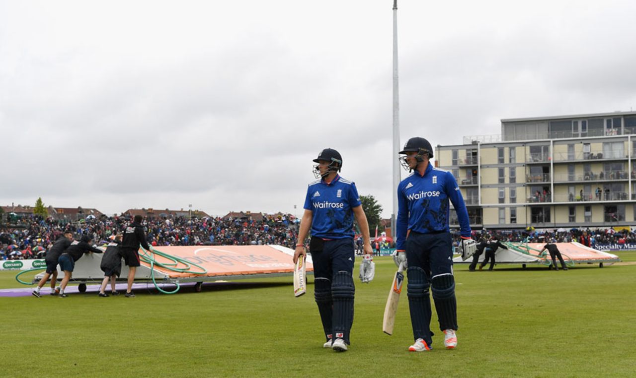 Joe Root and Jason Roy leave the field as the covers come on for the final time, England v Sri Lanka, 3rd ODI, Bristol, June 26, 2016