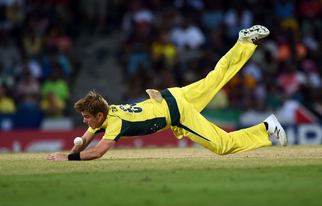 Adam Zampa dives to his left to field the ball, West Indies v Australia, ODI tri-series final, Barbados, June 26, 2016