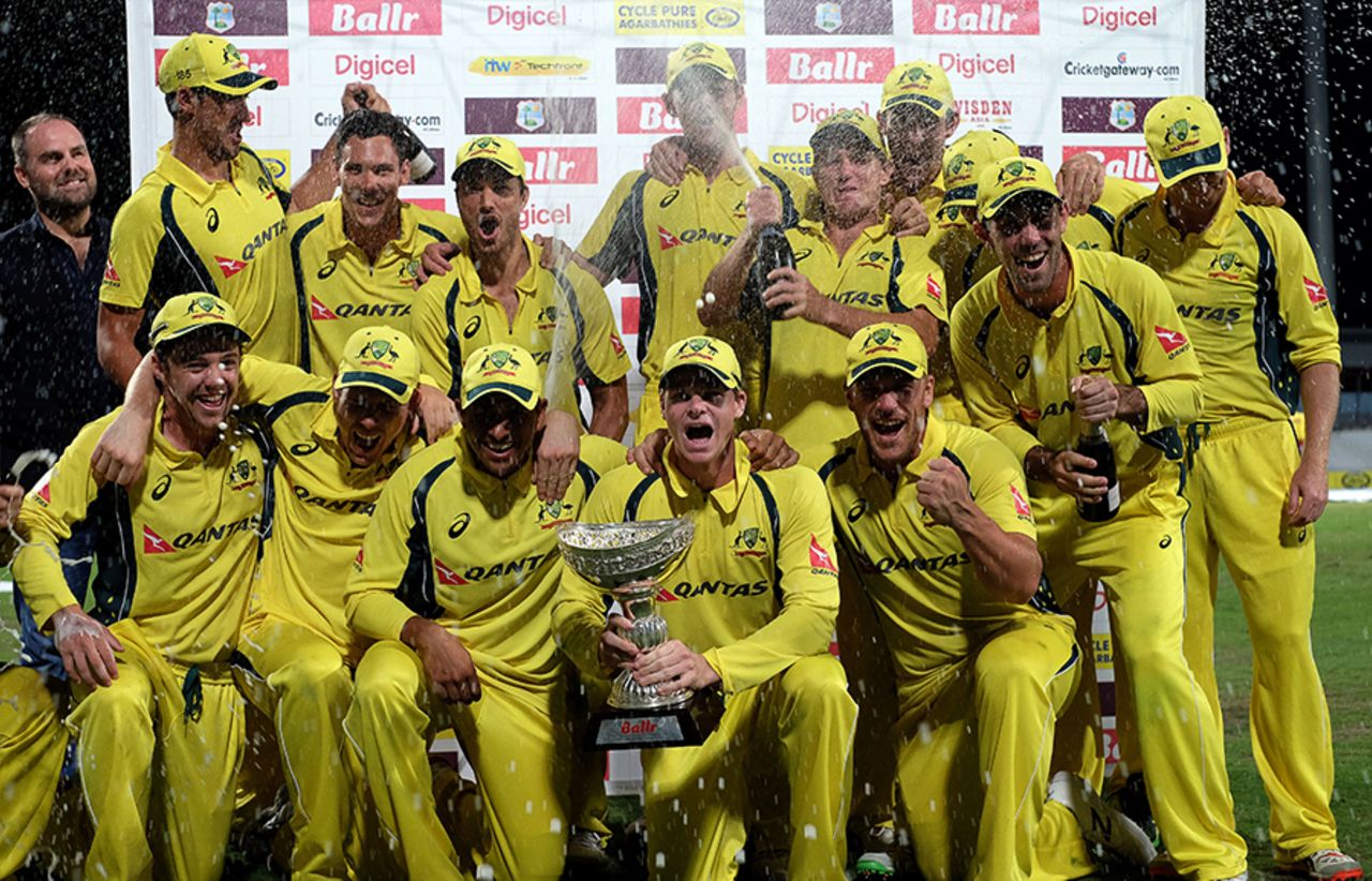 A jubilant Australia side pose with the trophy after their tri-series win, West Indies v Australia, ODI tri-series final, Barbados, June 26, 2016