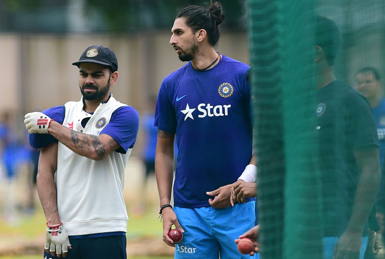 Virat Kohli and Ishant Sharma have a word during a practice session, Bangalore, June 30, 2016