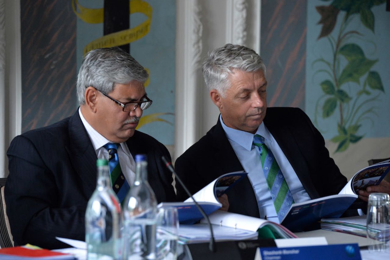 ICC chairman Shashank Manohar and chief executive David Richardson read on during an ICC meeting, Edinburgh, June 30, 2016