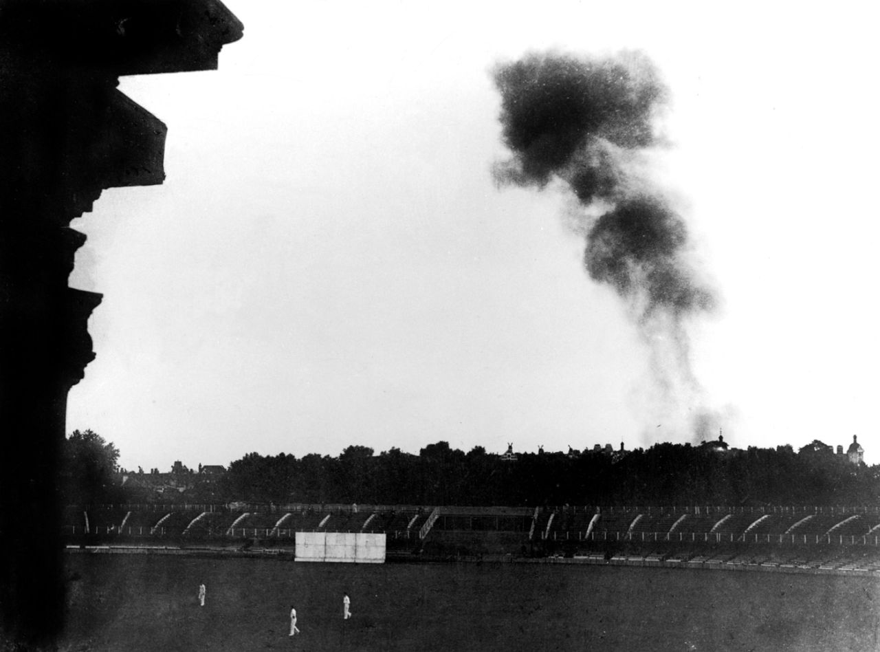Smoke from a V-1 flying bomb rises above Lord's during a wartime match, Army v Royal Air Force,  Lord's, July 29, 1944