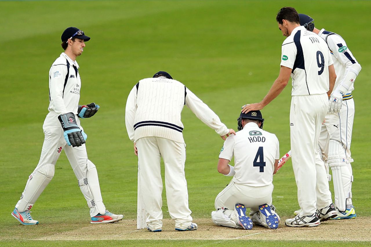 Andy Hodd is checked out after a blow to the helmet, Yorkshire v Middlesex, County Championship, Division One, Scarborough, 2nd day, July 4, 2016