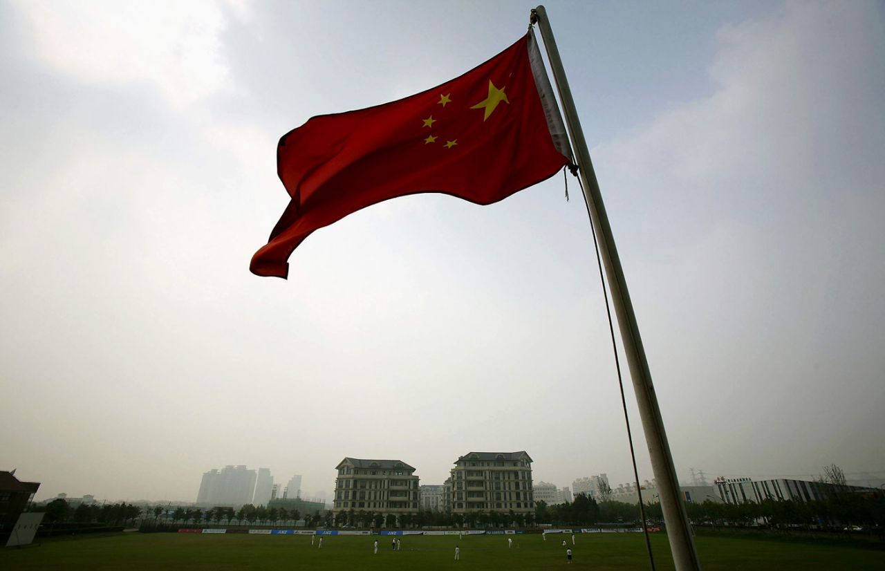 A China national flag flutters during a match between MCCand Shanghai Cricket Club at Dulwich College, Shanghai, October 5, 2006