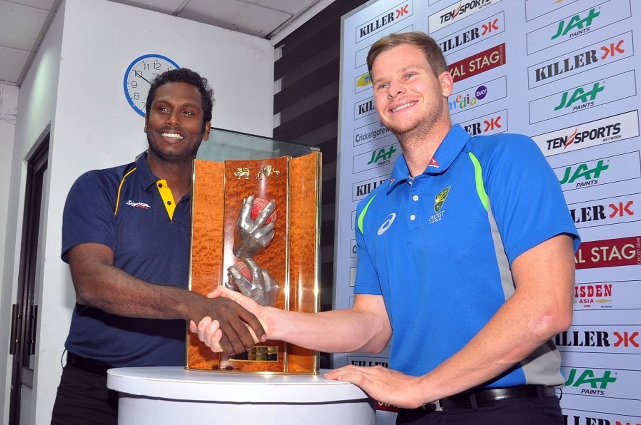 Angelo Mathews and Steven Smith pose with the Warne-Muralitharan trophy, Colombo, July 13, 2016