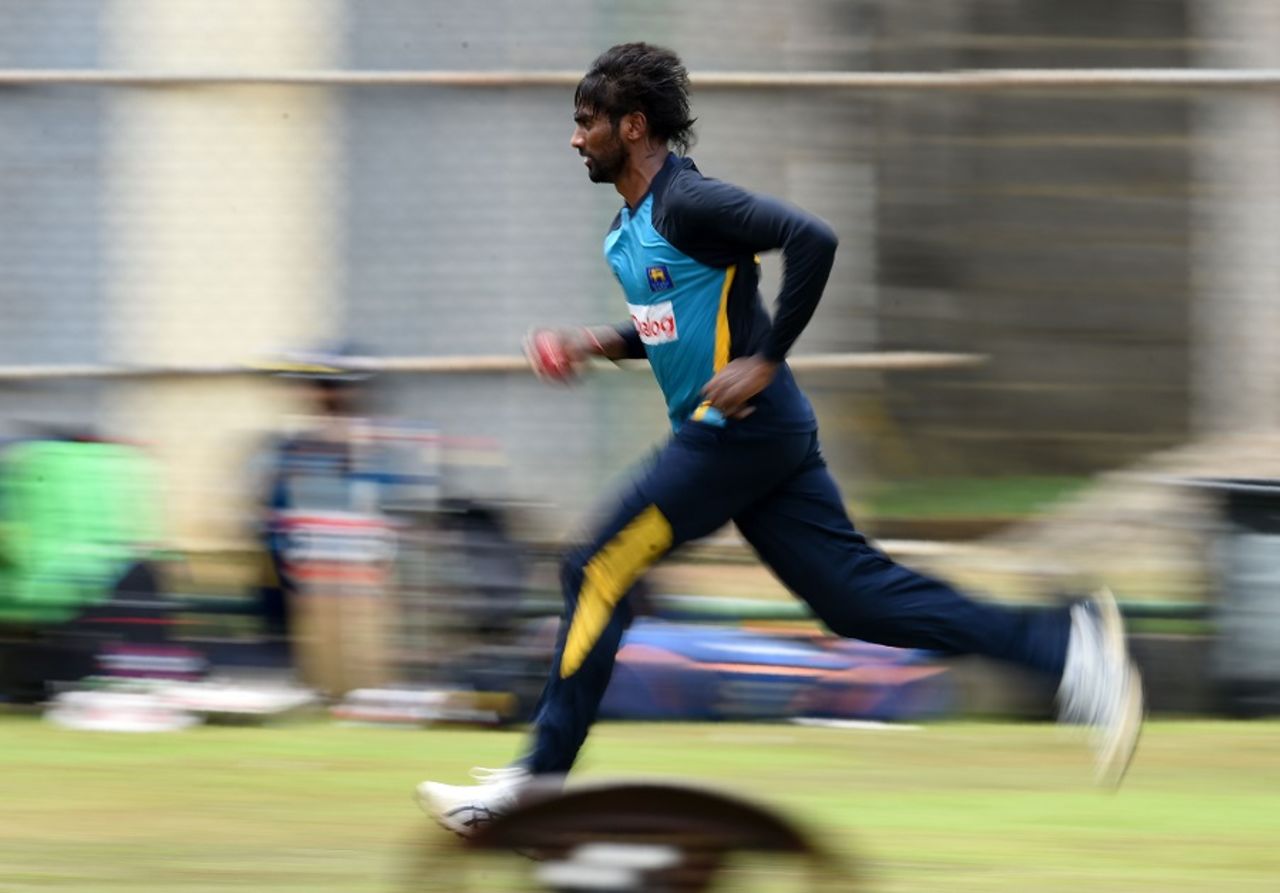 Nuwan Pradeep runs in to bowl during a practice session, Colombo, July 15, 2016