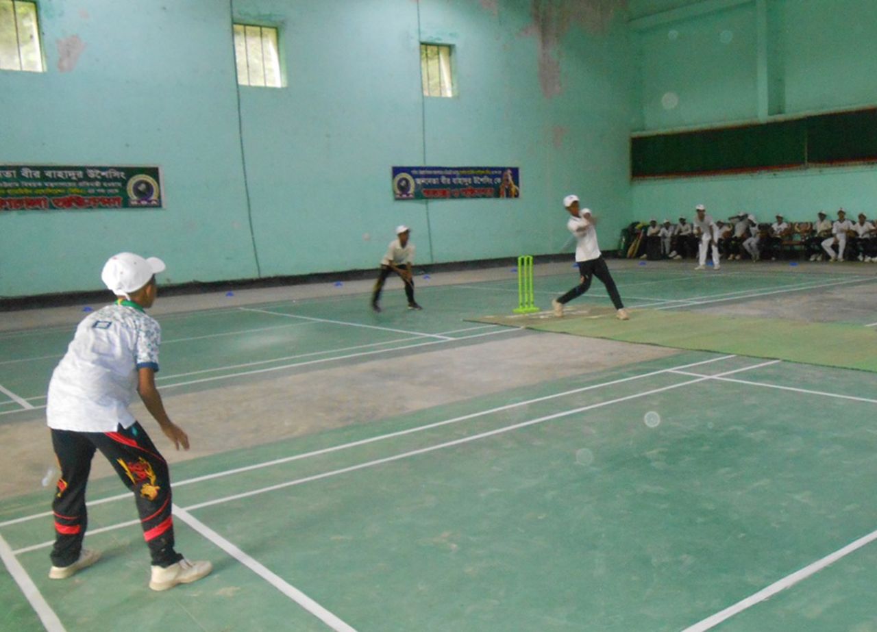 Youngsters play some cricket indoors, Bandarban, Bangladesh, July 16, 2016